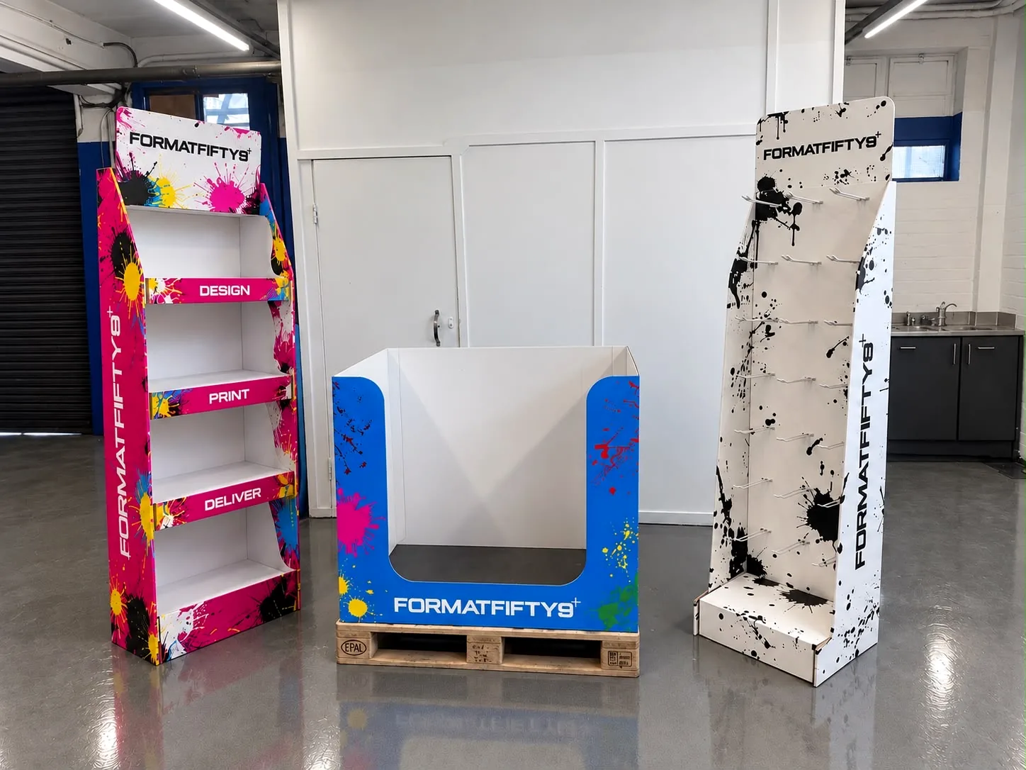 Formatfifty9-branded shelf FSDU, pallet unit and peg stand in the Formatfifty9 workshop